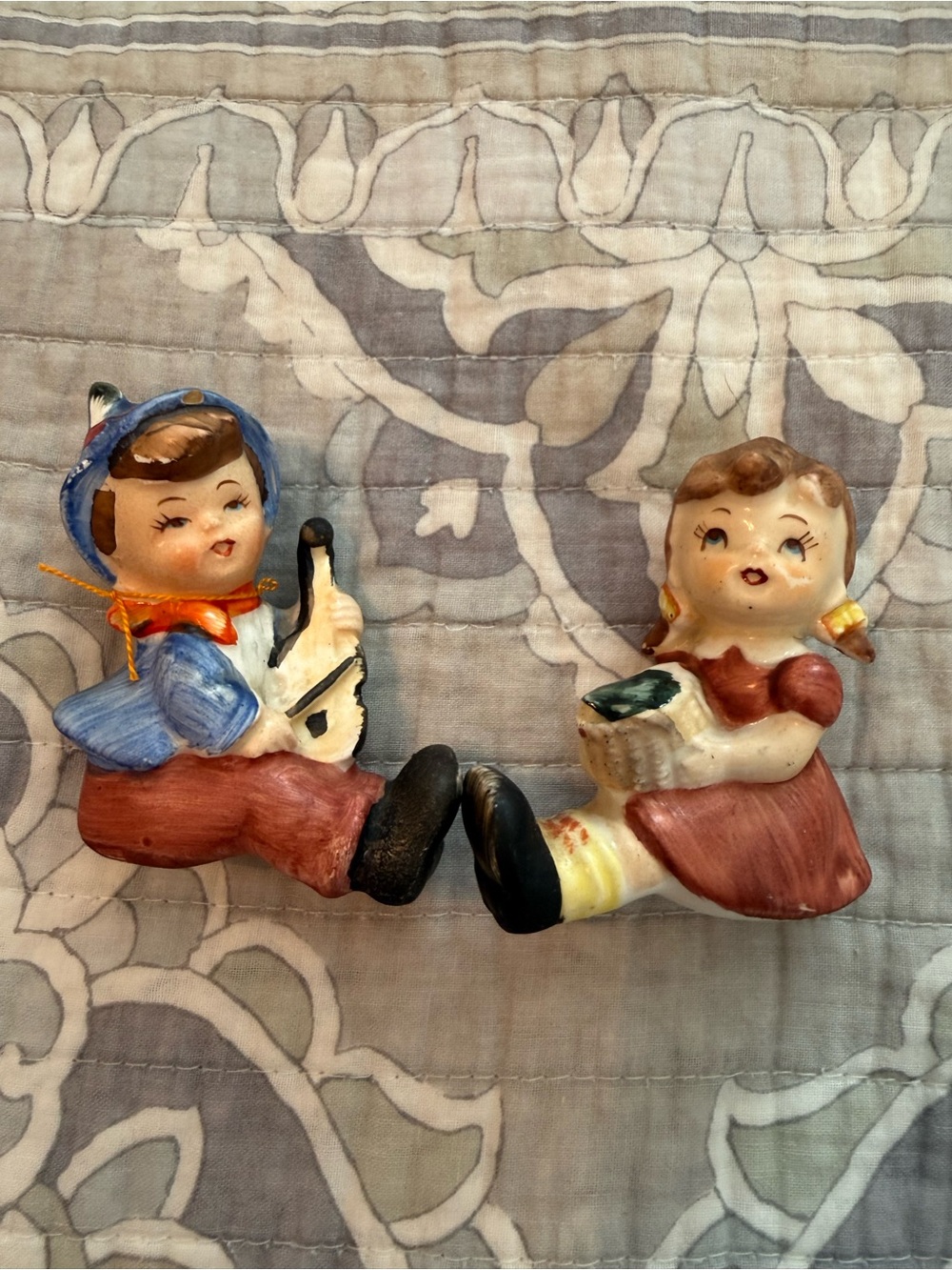 Vintage wales boy playing violin and Girl Figurine Pair in Blue, Red and Cream